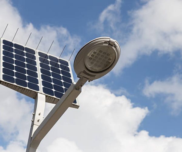 LED street light with solar cell and blue sky background on the street